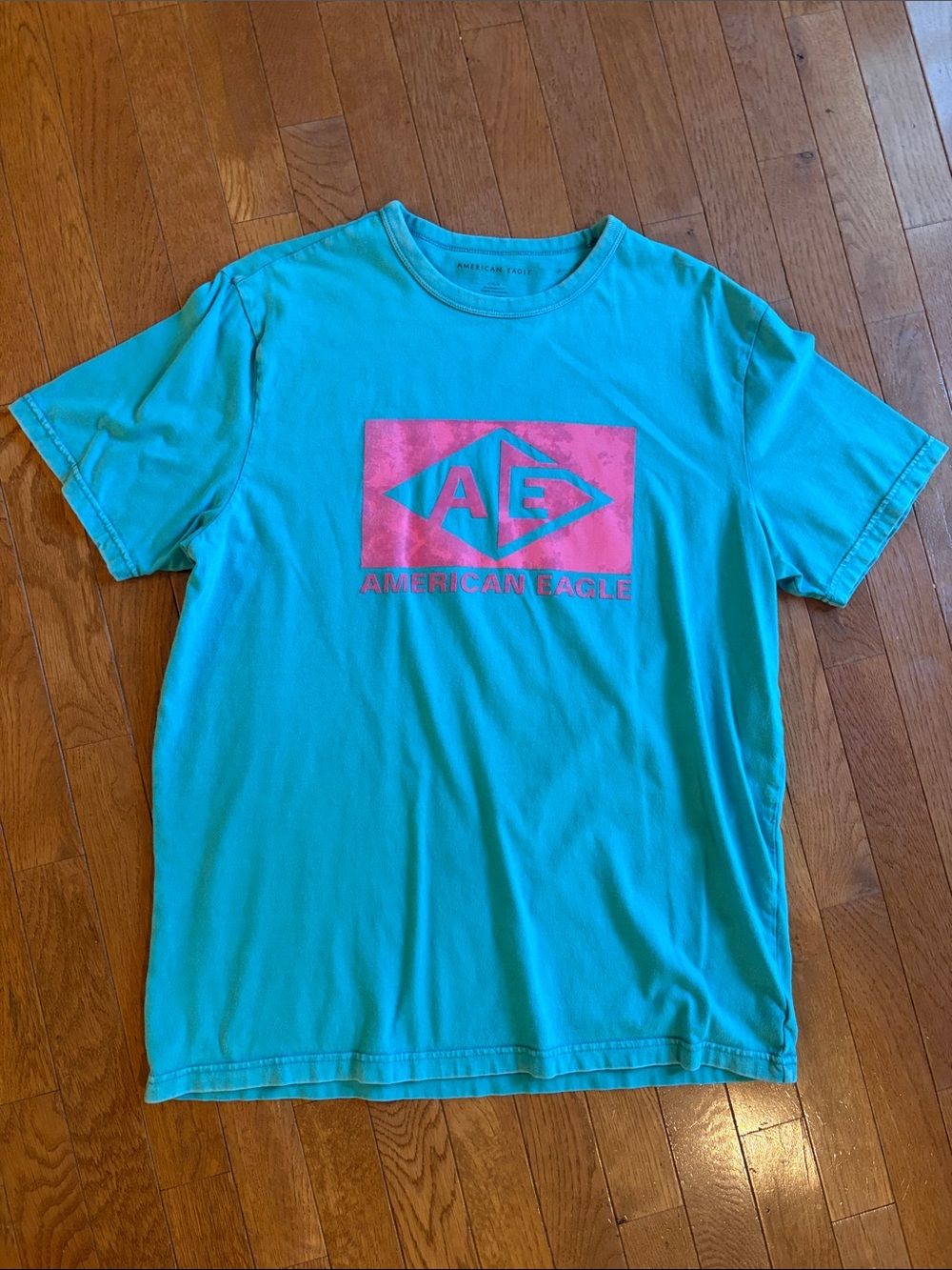 American Eagle Turquoise Short Sleeve Tee w/Pink Logo size large